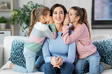 Image showing happy mother and daughters gossiping at home