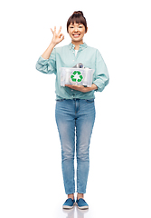 Image showing smiling young asian woman sorting metallic waste