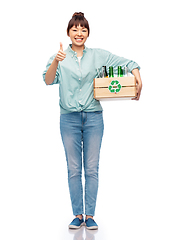 Image showing smiling young asian woman sorting glass waste