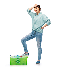 Image showing tired young asian woman sorting plastic waste