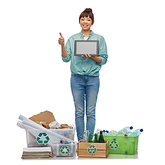 Image showing smiling asian woman with tablet pc sorting waste