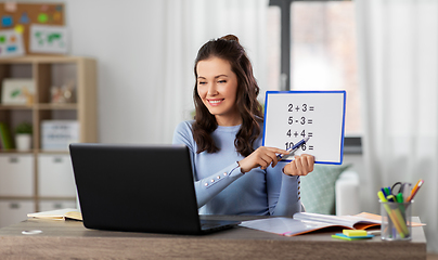 Image showing math teacher having online class at home