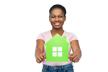 Image showing smiling african american woman holding green house