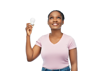 Image showing african american woman holding lighting bulb