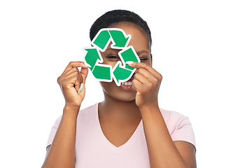 Image showing smiling asian woman holding green recycling sign