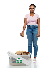 Image showing happy african american woman sorting paper waste