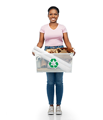 Image showing happy african american woman sorting paper waste