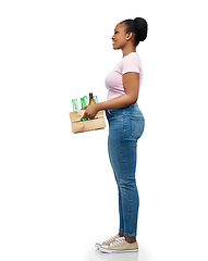 Image showing happy african american woman sorting glass waste