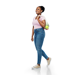 Image showing african woman with food in reusable string bag