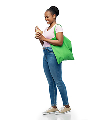 Image showing happy woman with reusable bag for food and wok