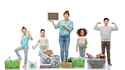 Image showing happy woman with little children sorting waste