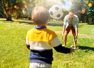 Image showing father with little son playing soccer at park