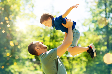 Image showing happy father with son playing in summer park