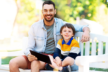 Image showing father and son with tablet pc computer at park