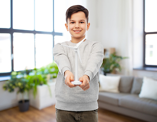 Image showing smiling boy with toy wind turbine