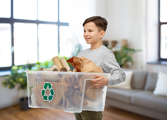 Image showing smiling boy sorting paper waste