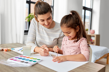 Image showing mother with little daughter drawing at home