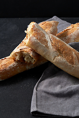 Image showing close up of baguette bread on kitchen towel