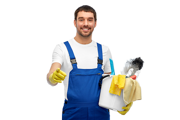 Image showing male cleaner in overall with cleaning supplies