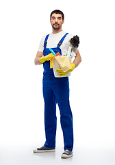 Image showing male cleaner in overal with cleaning supplies