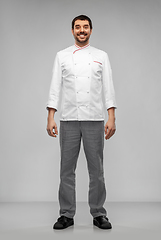 Image showing happy smiling male chef in jacket