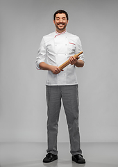 Image showing happy smiling male chef or baker with rolling pin