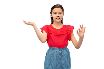 Image showing girl holding something on hand and showing ok