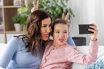 Image showing happy family taking selfie by smartphone at home