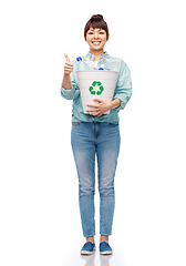 Image showing smiling young woman sorting plastic waste