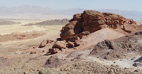 Image showing Scenic orange rocks in stone desert near Eilat, Israel