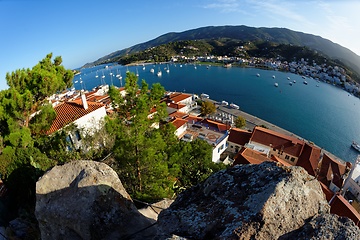 Image showing High angle fisheye view of Poros town in Greece in the evening, seen from the bottom of the clock tower