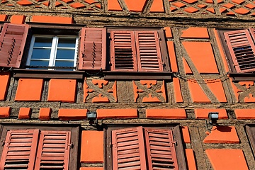 Image showing Facade of fachwerkhaus, or timber framing, in Riquewihr village, Alsace, France