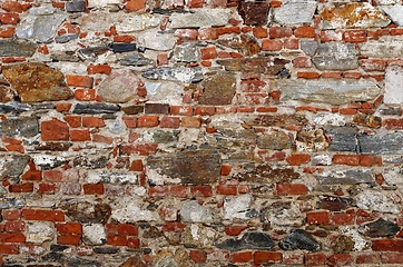 Image showing Texture of old wall built of red bricks and uneven stones