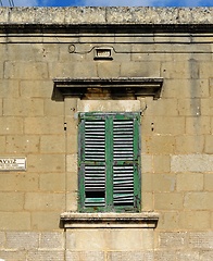 Image showing Closed window of the old building covered by green wooden blinds in Rabat town on Malta