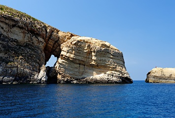 Image showing Scenic rocks with a hole near Gozo island on Malta, on bright summer day