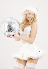 Image showing sexy santa helper with disco ball