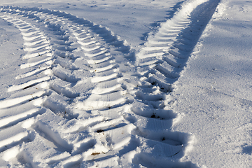 Image showing Traces of the car on the snow