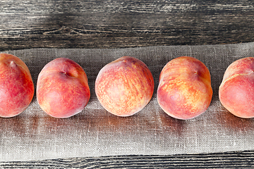 Image showing row ripe orange peaches