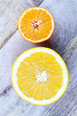 Image showing cut half orange and mandarin