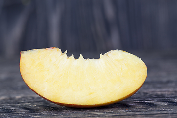 Image showing one fresh slice of ripe peach