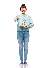 Image showing smiling young asian woman sorting metallic waste