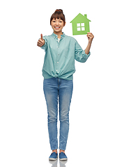 Image showing asian woman with green house showing thumbs up