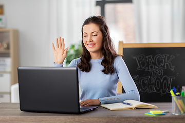 Image showing teacher with laptop having online class at home