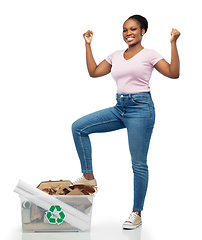 Image showing happy african american woman sorting paper waste