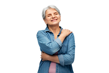 Image showing portrait of smiling senior woman in denim shirt