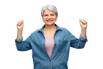 Image showing portrait of smiling senior woman in denim shirt