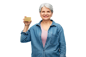 Image showing portrait of smiling senior woman with credit card