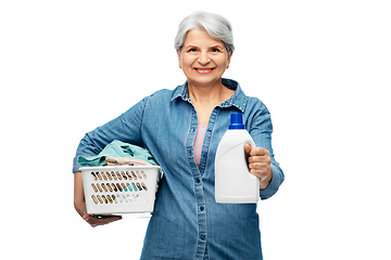 Image showing smiling senior woman with laundry basket