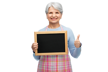 Image showing old woman in apron with menu showing thumbs up