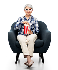 Image showing old woman in 3d glasses with popcorn watches movie